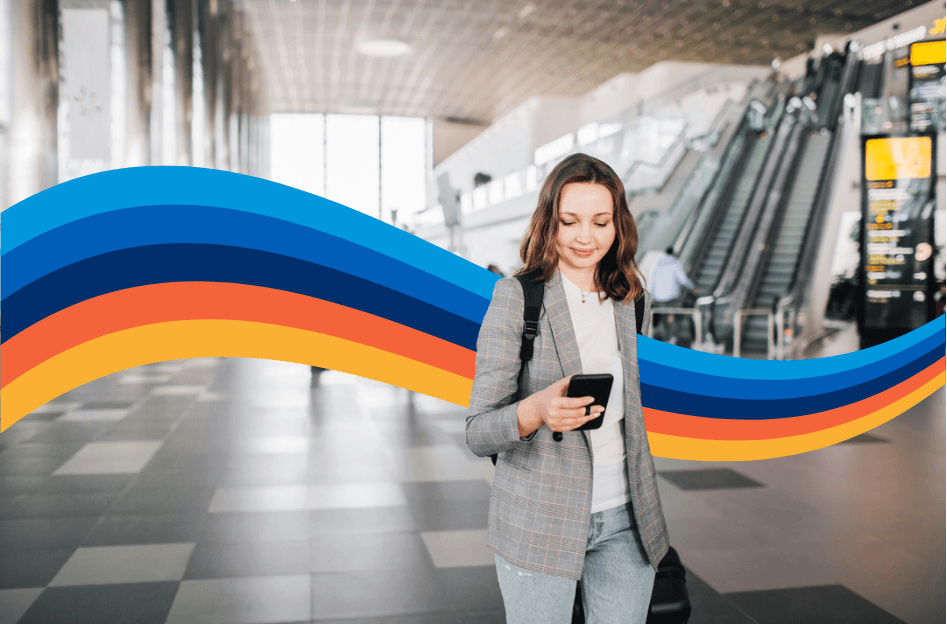 Woman looking at phone at the airport