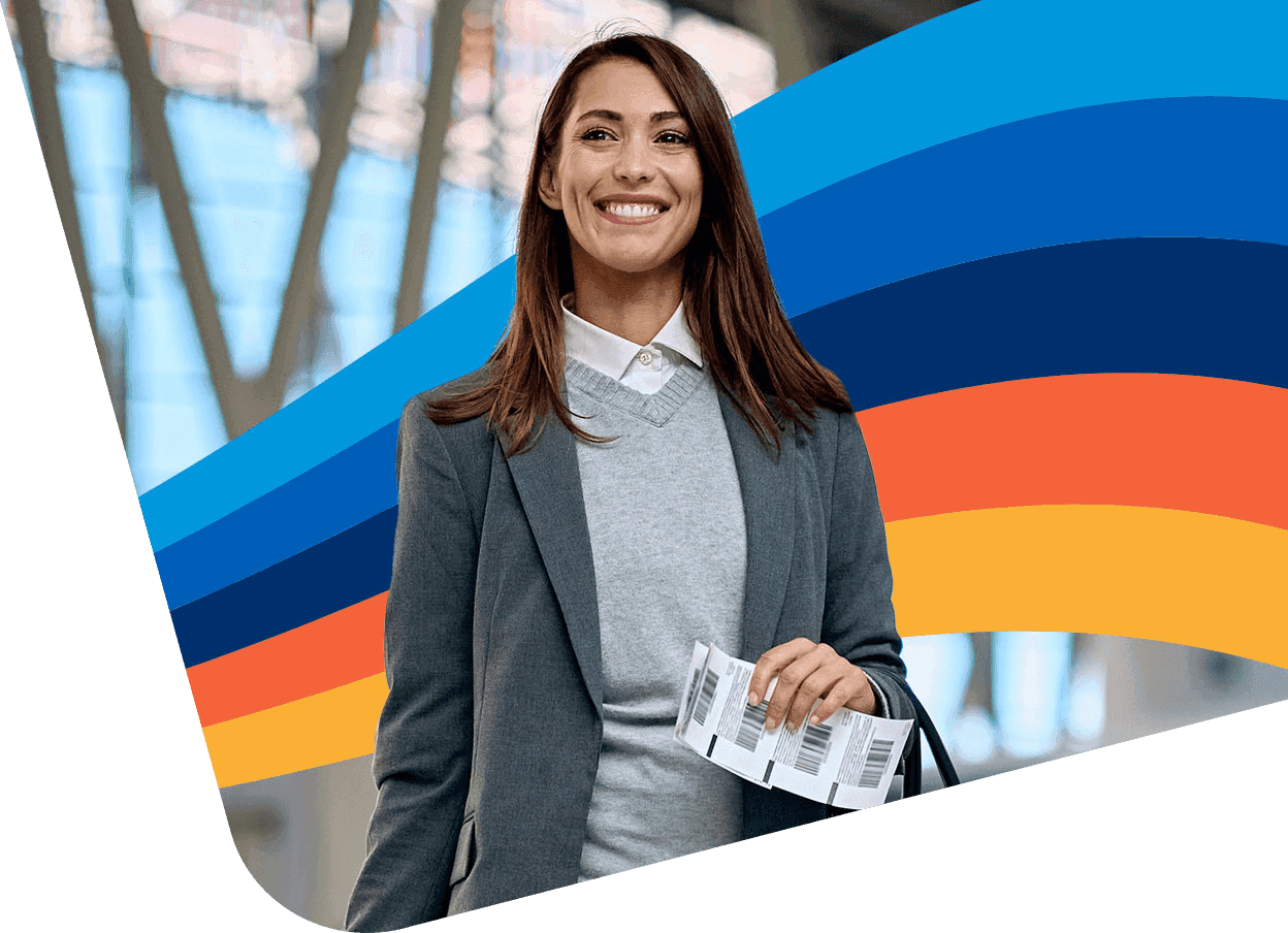 a woman in a suit is smiling and holding a ticket