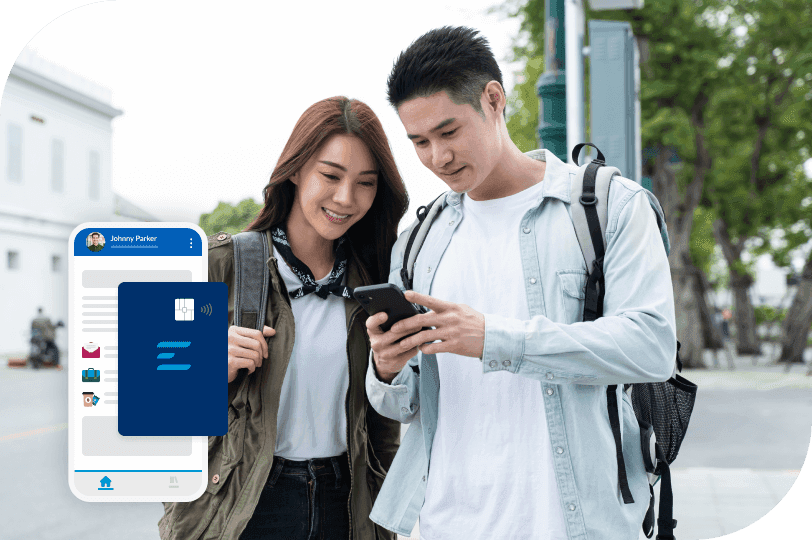 a man and a woman are looking at a cell phone